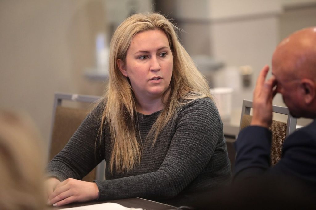 Small Shops Chase Late Payments With New Reporting Rules small business owner working in her shop
