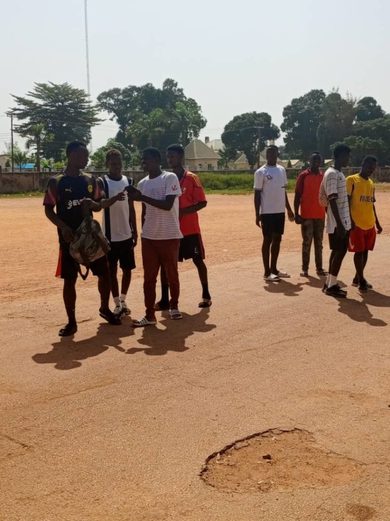 Youth Football Coaches Rethink Feedback to Keep Teenagers in Sport young footballers training on a grass field