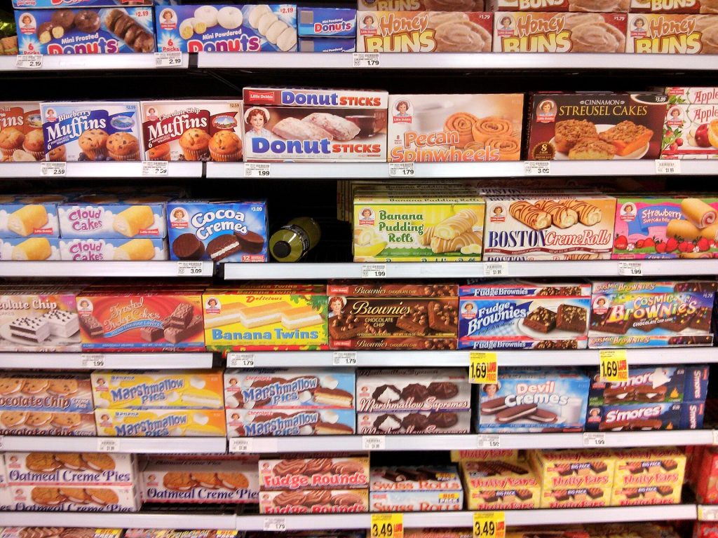 Nine in Ten Papers Disputing Ultra-Processed Food Definition Had Industry Ties Fresh and packaged foods side by side for a nutrition research illustration
